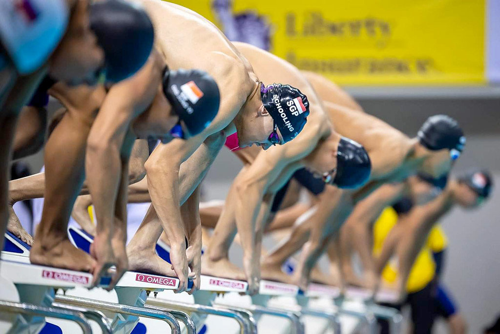 begining of a swim race on the blocks